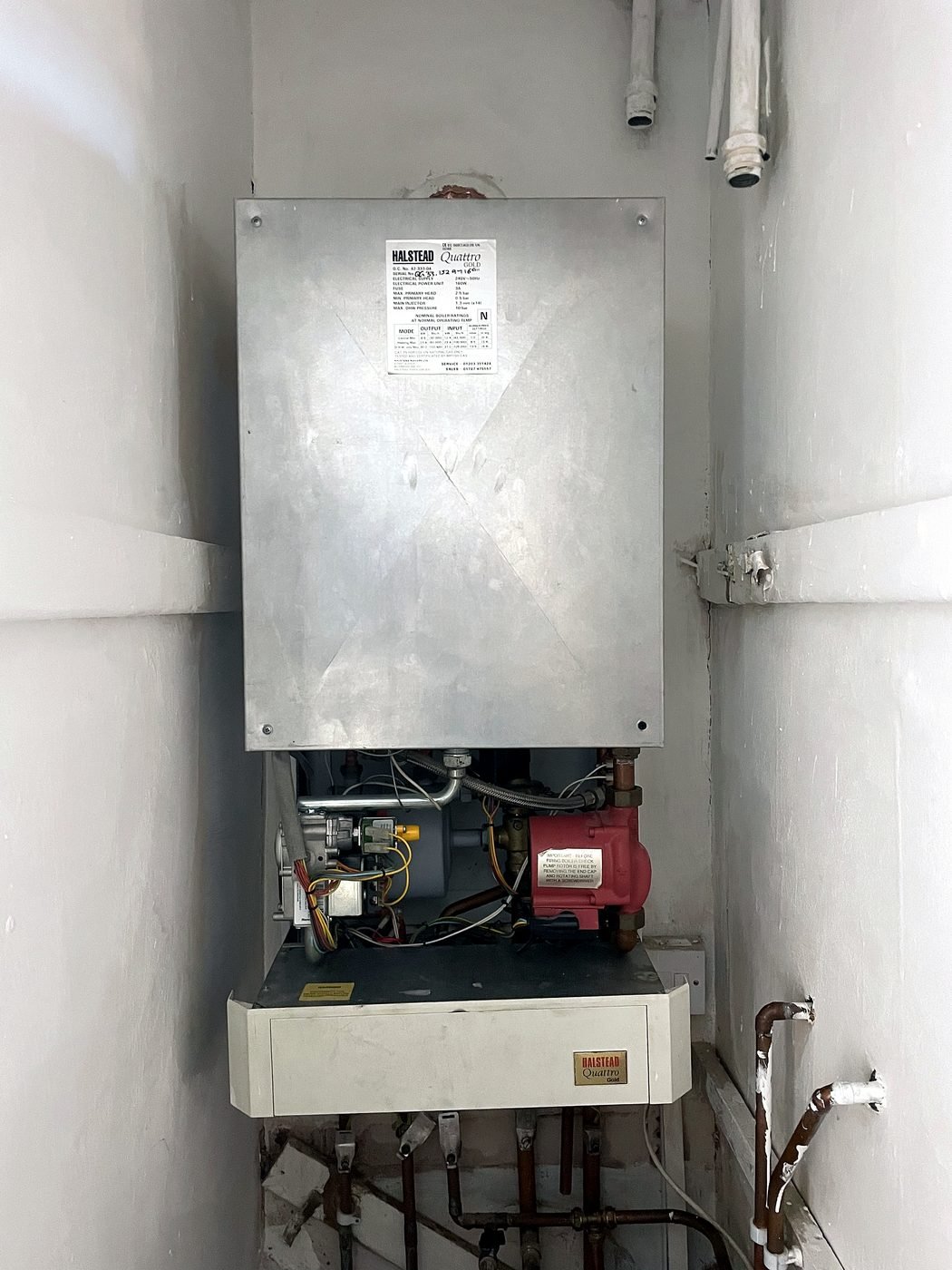 An old Halstead Quattro Gold boiler with the casing removed, ahead of replacement