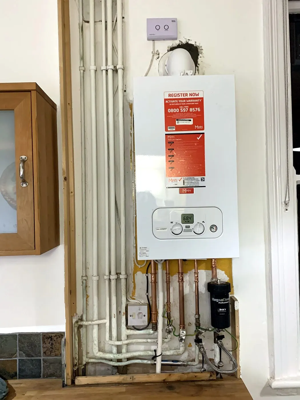 Main Eco Compact combi installed in a kitchen with magnetic filter